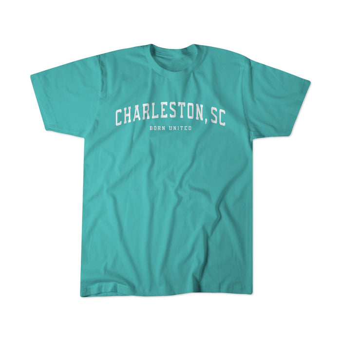 The Charleston United Tee by Born United Private Label features CHARLESTON, SC in bold white letters across the chest with BORN UNITED beneath on a turquoise backdrop, perfect for those connected to this historic city.
