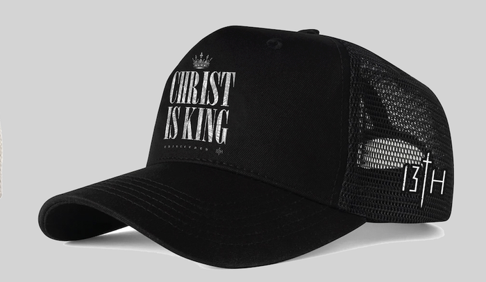 The Christ is King Trucker Snapback by 13th features bold white text with a crown graphic on the front and “13TH” plus a cross on the side, letting you share your faith in style wherever you go.