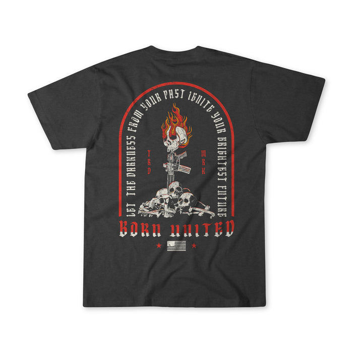 The Let the Darkness T-Shirt by Born United Private Label features flaming skulls, crossed rifles, bullets, and "Let the darkness from your past ignite your brightest future." Small American flag at the bottom.