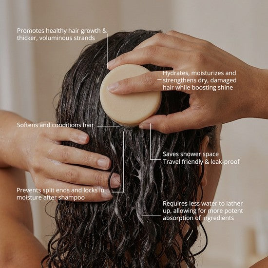 Tea-Shirt Shoppe natural shampoo and conditioner bar being applied to wet hair to hydrate and strengthen strands.