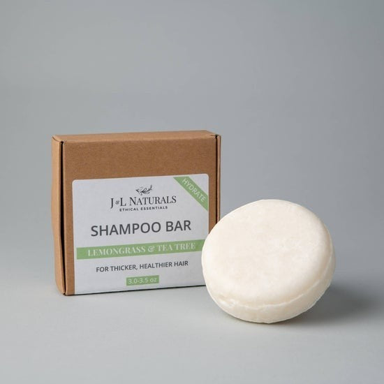 Tea-Shirt Shoppe natural lemongrass and tea tree shampoo bar with eco-friendly cardboard packaging.